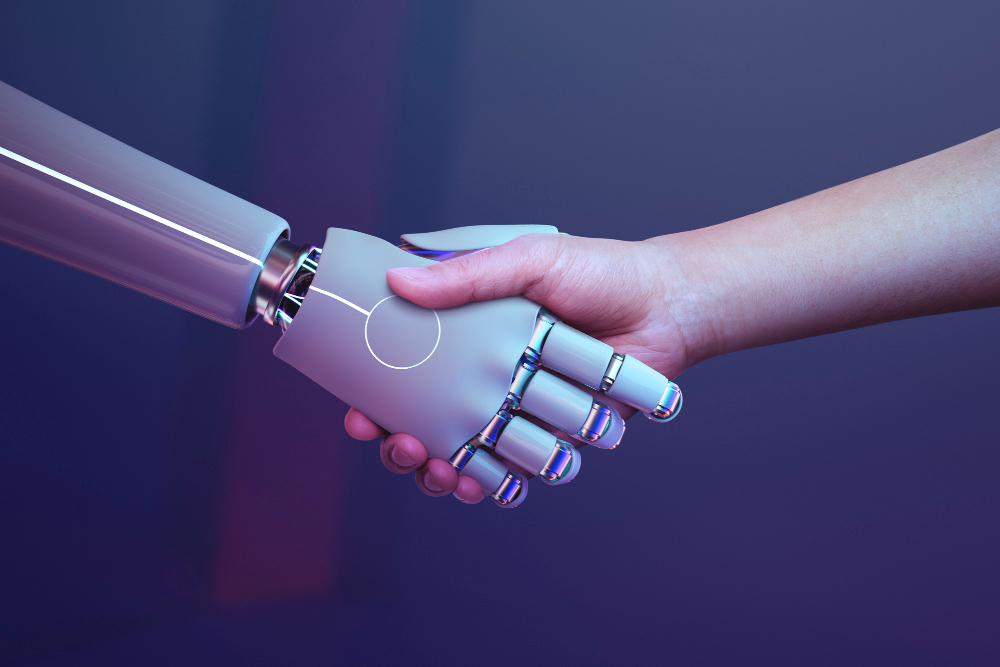 Tecnología para la Vida TXLV - Micro Magazine de FUNTESO, Fundación Tecnología Social imagen de las manos estrechadas de un humano y un robot
